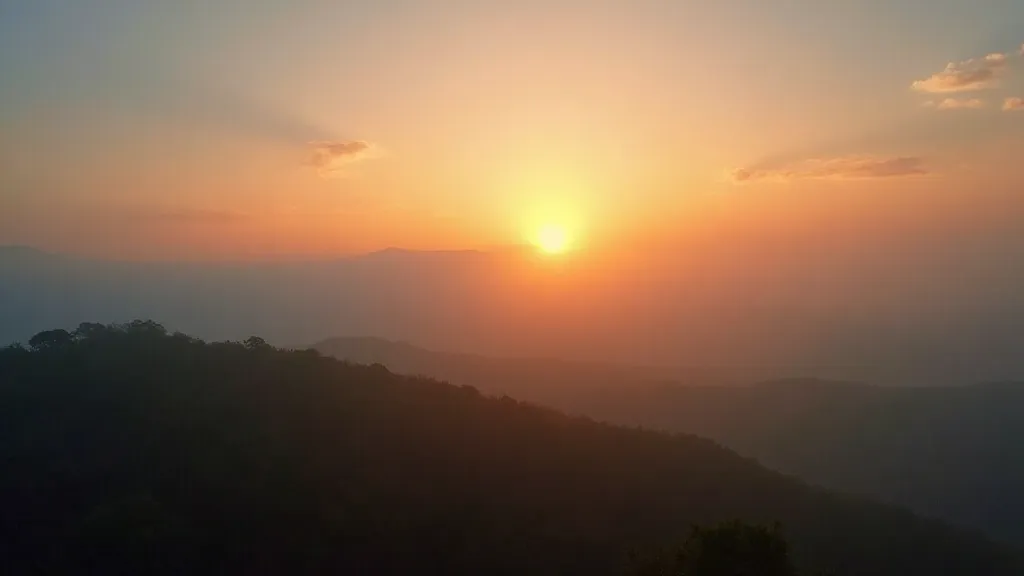 Sunrise through a layer of low-lying clouds